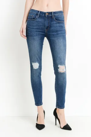 Mid rise dark denim skinny jeans with distressing